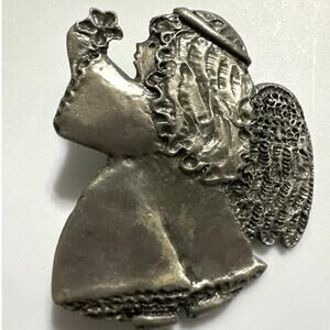 Hallmark pewter angel brooch featuring a small girl angel holding a flower vint.
